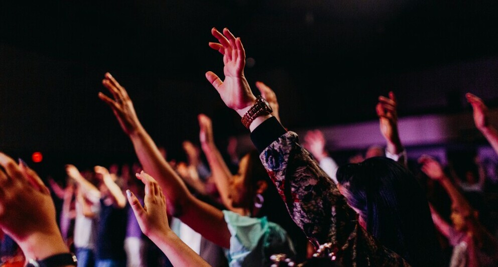 This photograph shows a diverse group of people’s hands raised in praised for Yahweh Yasharahla. It’s being used to convey the idea that Yahweh’s people are very diverse and only their actions can identify them.